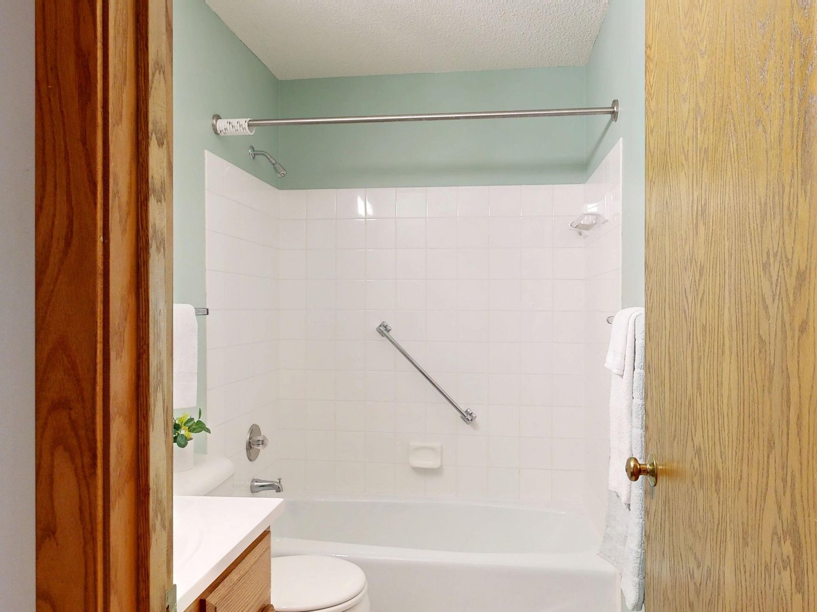 Walk-in shower with grab bars, a common project under VA home modification grants