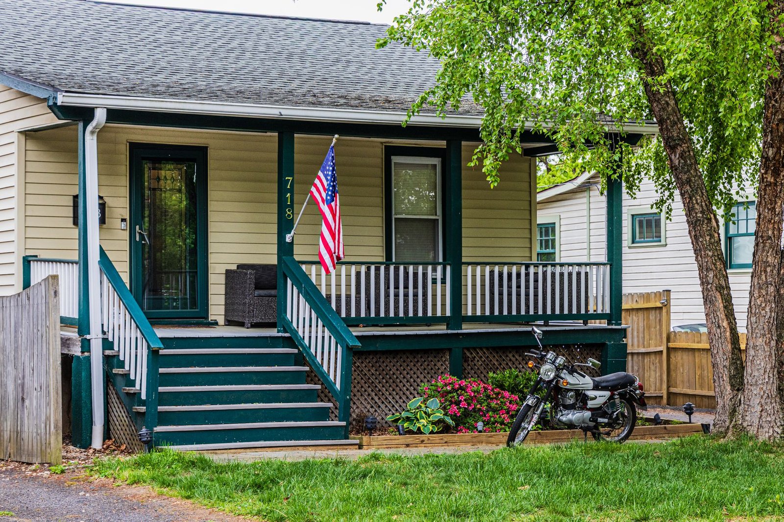 American flag outside a family home, symbolizing veterans nursing home care options close to home