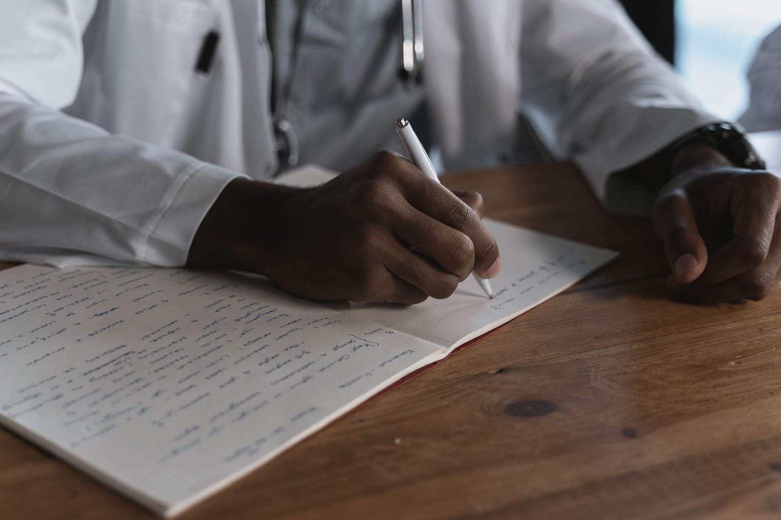 A physician drafting a nexus letter for a VA claim after reviewing medical records