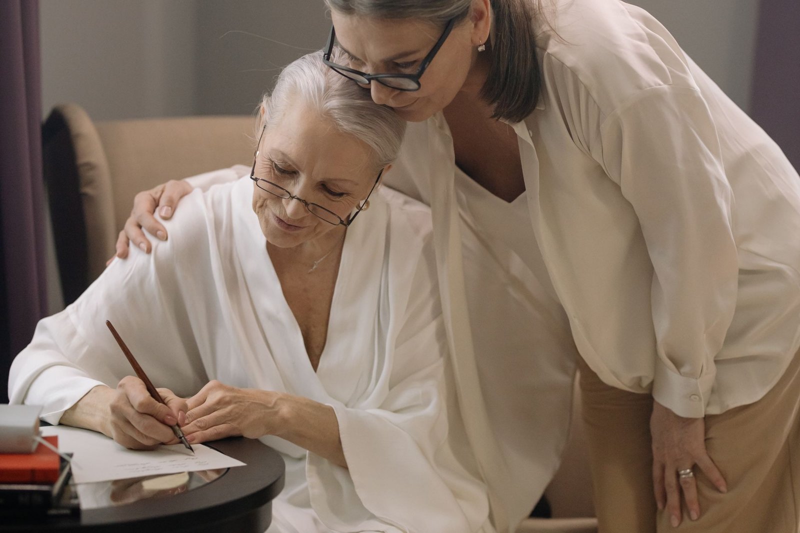 An adult child helps her mother organize documents for a VA accrued benefits and substitution request