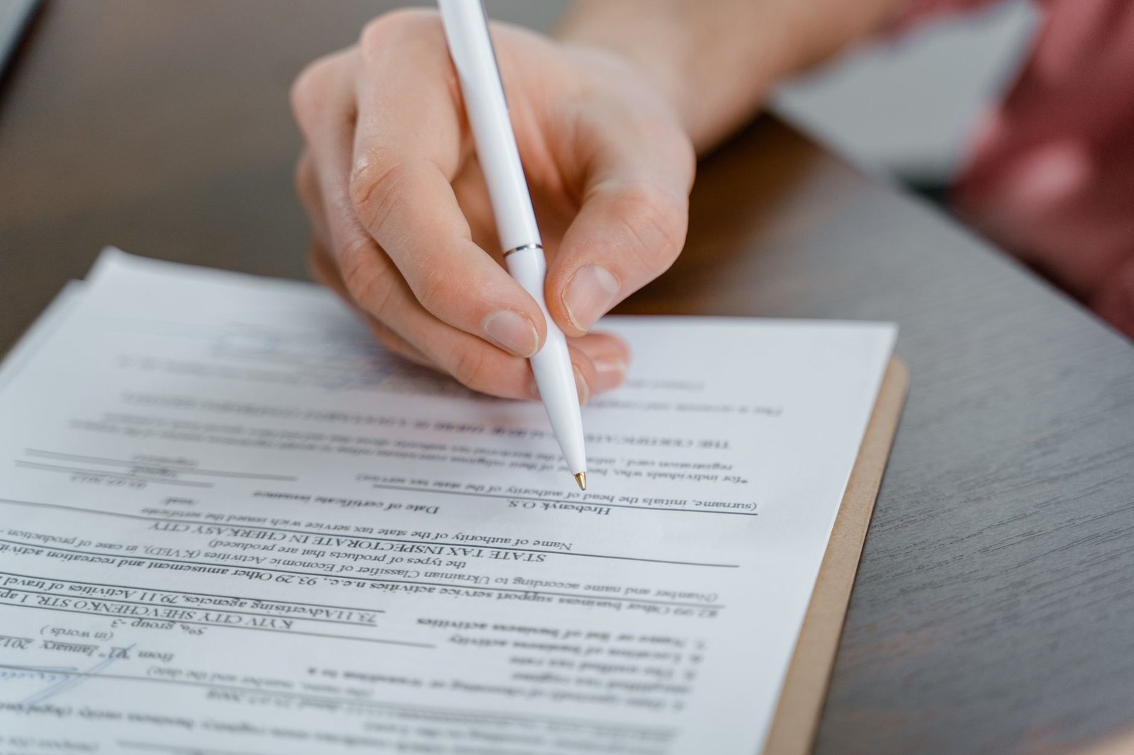 Family member completing VA claim forms for a Merchant Marine veteran exposed to asbestos