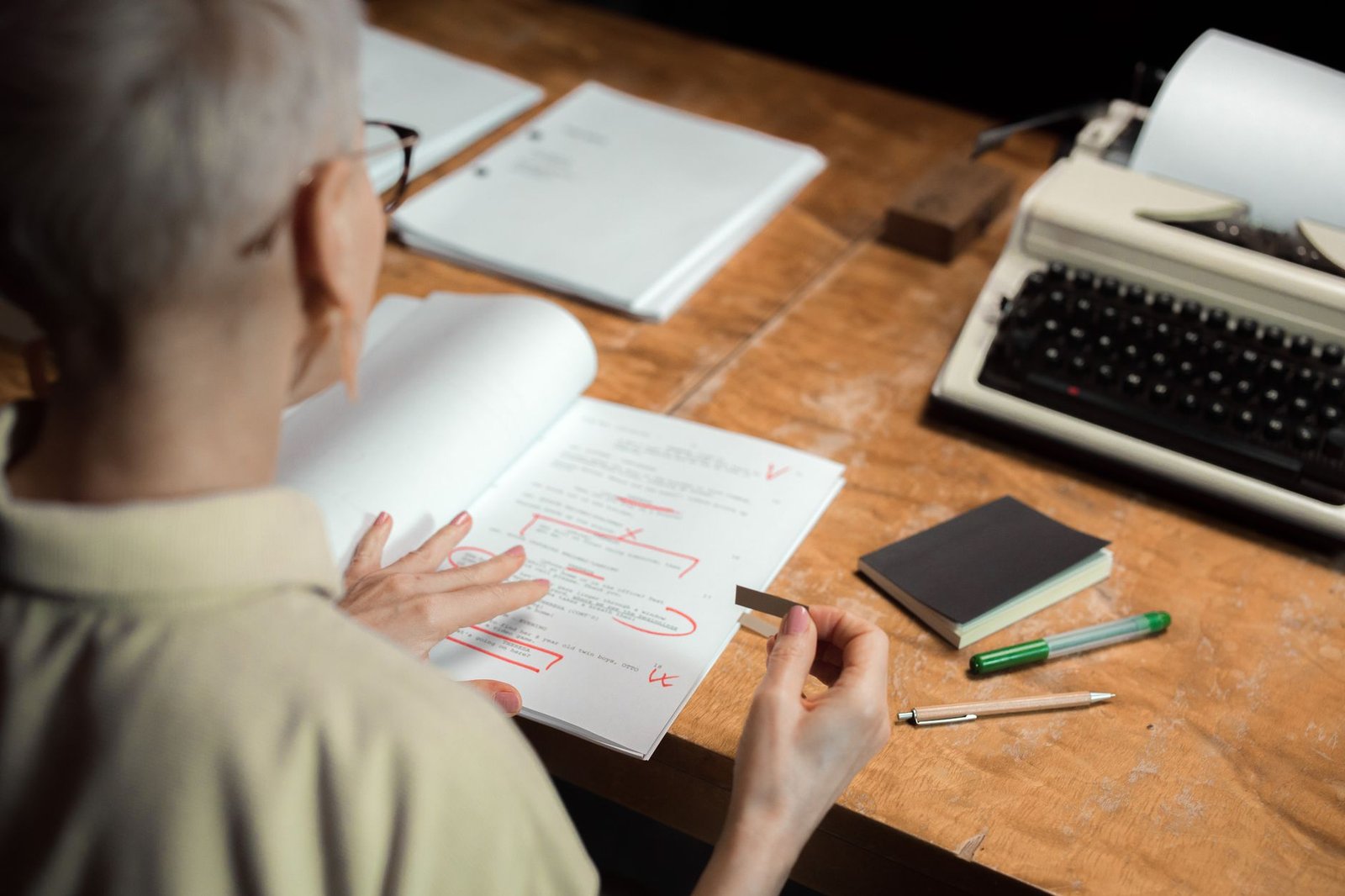 A surviving spouse reviews paperwork for a VA accrued benefits claim at her kitchen table
