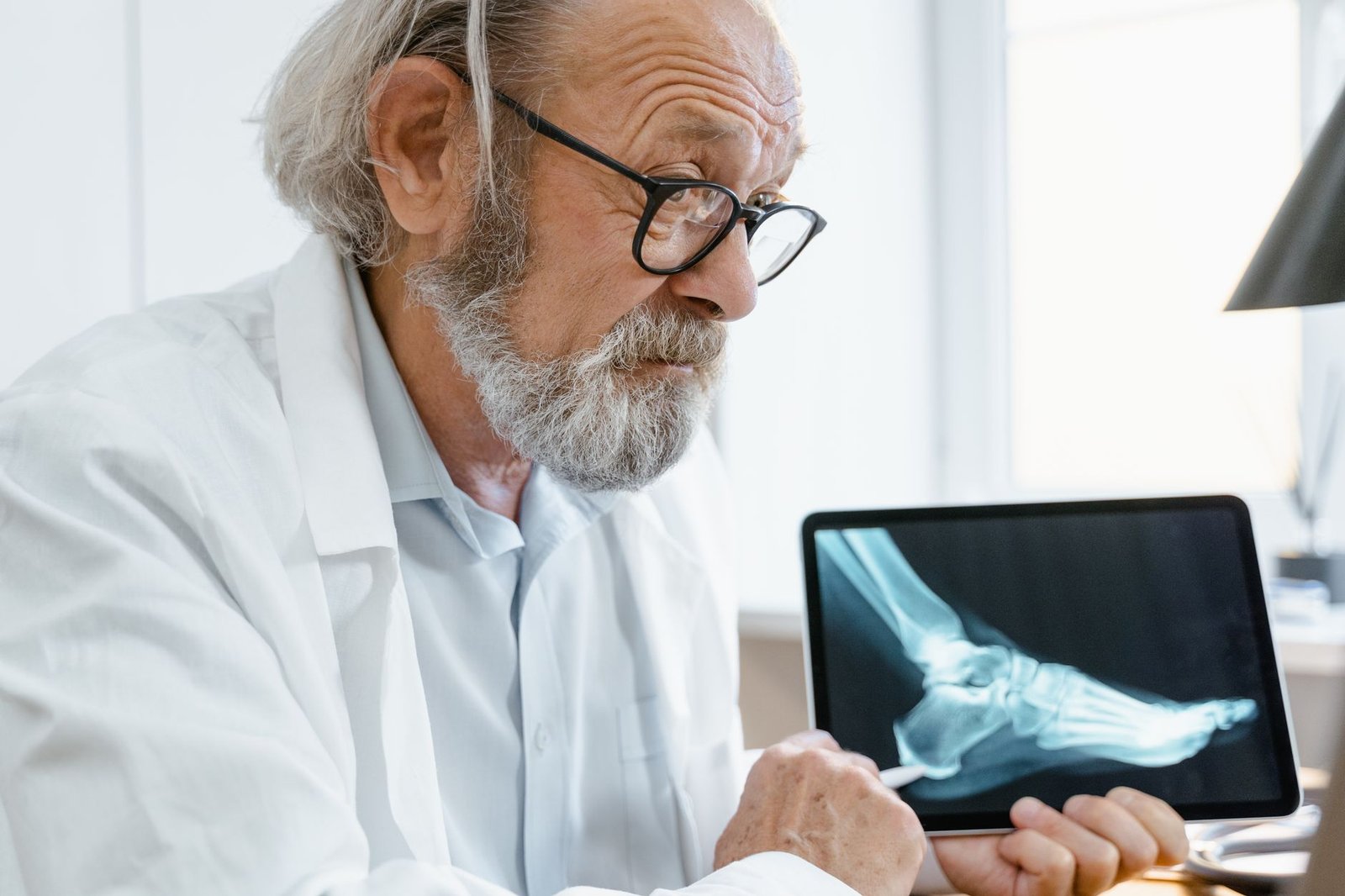 A doctor discussing a nexus letter for VA claim purposes with an older veteran