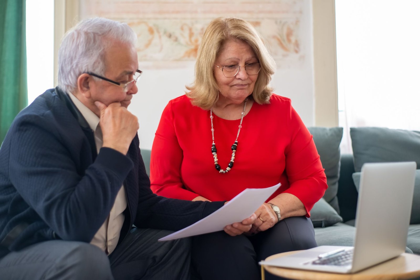 Family reviewing long-term care paperwork while exploring VA nursing home care for veterans