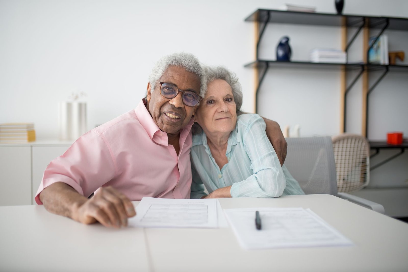 A veteran and spouse reviewing paperwork about mesothelioma treatment coverage through the VA
