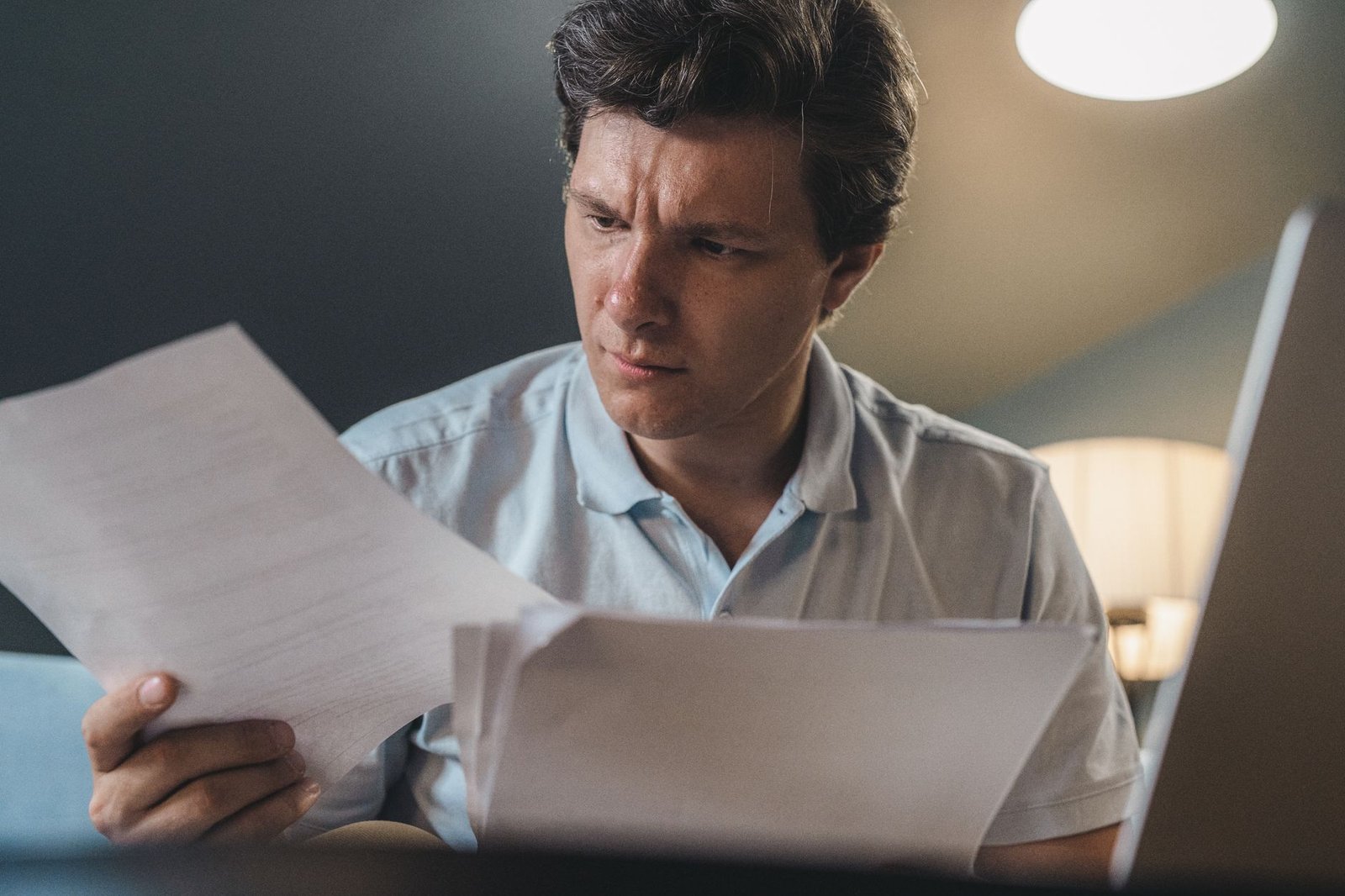 Veteran reviewing enrollment paperwork related to VA priority groups for cancer patients